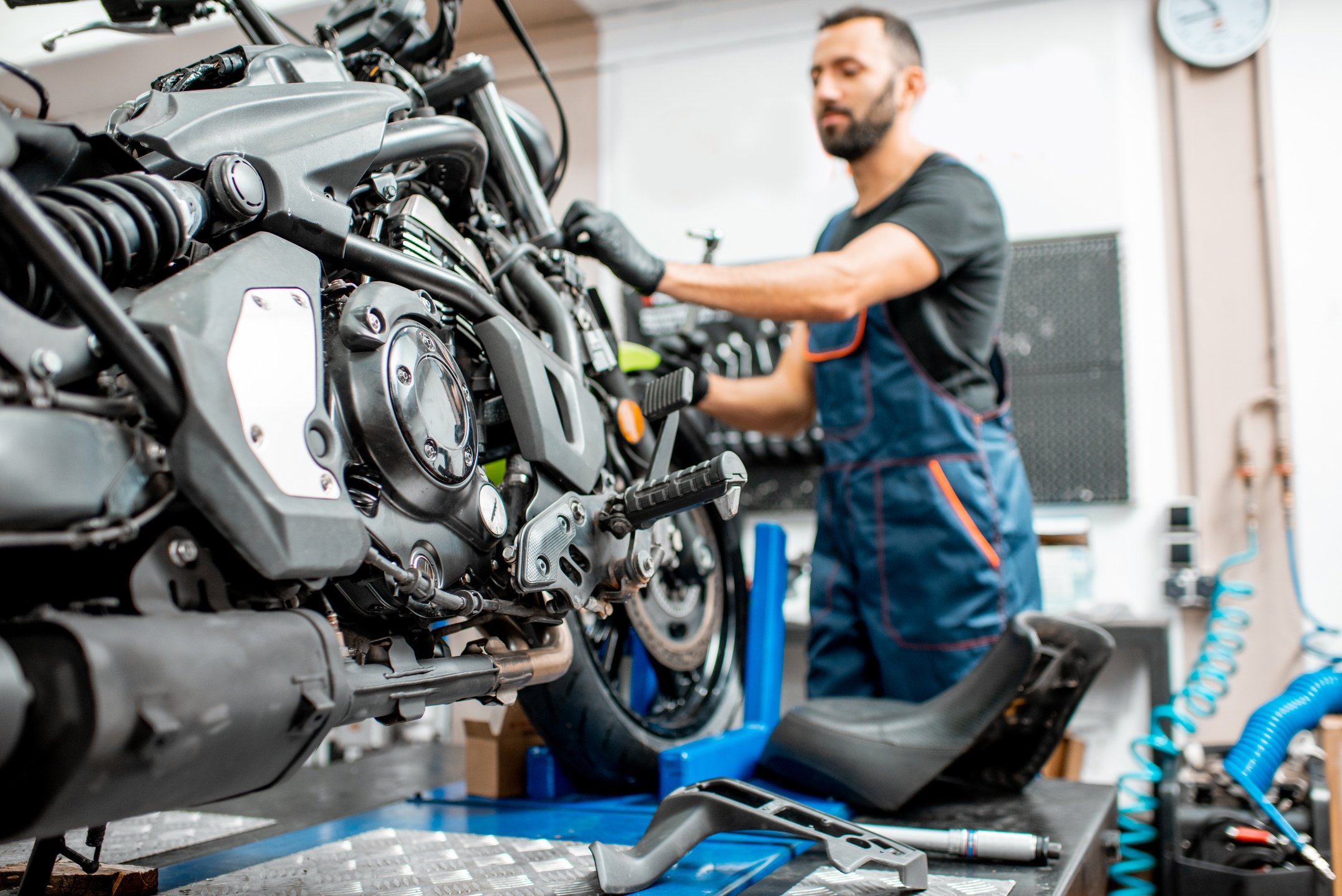 Motorcycle with Worker at the Workshop